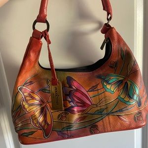 A beautiful Anushka handbag with hand-painted detailing.